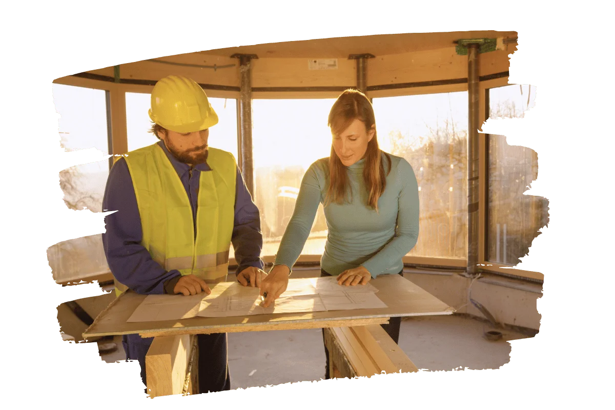 homeowner and contractor planning for window replacement